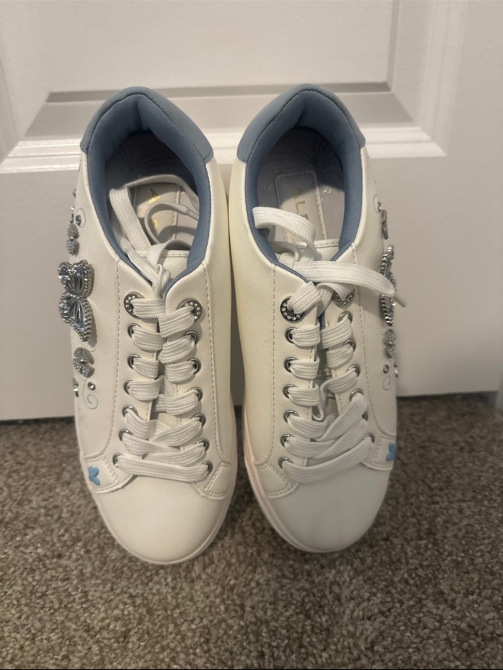 Aldo White Sneakers with Light Blue Lining and Silver Embellishments